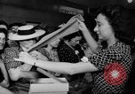 Image of women buying silk stockings during war ration United States USA, 1942, second 27 stock footage video 65675053064