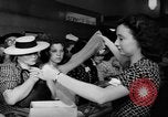 Image of women buying silk stockings during war ration United States USA, 1942, second 28 stock footage video 65675053064