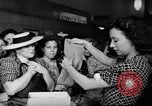 Image of women buying silk stockings during war ration United States USA, 1942, second 30 stock footage video 65675053064