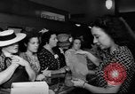 Image of women buying silk stockings during war ration United States USA, 1942, second 31 stock footage video 65675053064
