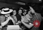 Image of women buying silk stockings during war ration United States USA, 1942, second 32 stock footage video 65675053064