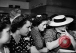 Image of women buying silk stockings during war ration United States USA, 1942, second 34 stock footage video 65675053064