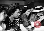 Image of women buying silk stockings during war ration United States USA, 1942, second 35 stock footage video 65675053064