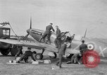 Image of Spitfire airplanes readied for combat United Kingdom, 1940, second 18 stock footage video 65675053155