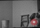 Image of One armed paperhanger United States USA, 1943, second 10 stock footage video 65675053440