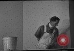 Image of One armed paperhanger United States USA, 1943, second 11 stock footage video 65675053440