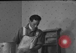 Image of One armed paperhanger United States USA, 1943, second 22 stock footage video 65675053440