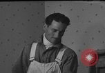 Image of One armed paperhanger United States USA, 1943, second 37 stock footage video 65675053440