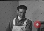 Image of One armed paperhanger United States USA, 1943, second 49 stock footage video 65675053440