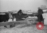 Image of Ukraine farm workers on snow covered farm Kiev Ukraine, 1947, second 30 stock footage video 65675053671
