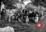 Image of Women pick up abandoned flowers London England United Kingdom, 1938, second 3 stock footage video 65675053799