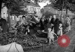 Image of Women pick up abandoned flowers London England United Kingdom, 1938, second 5 stock footage video 65675053799