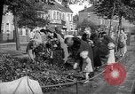 Image of Women pick up abandoned flowers London England United Kingdom, 1938, second 7 stock footage video 65675053799
