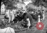 Image of Women pick up abandoned flowers London England United Kingdom, 1938, second 12 stock footage video 65675053799
