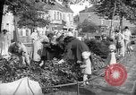 Image of Women pick up abandoned flowers London England United Kingdom, 1938, second 14 stock footage video 65675053799
