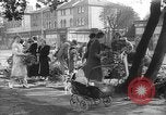 Image of Women pick up abandoned flowers London England United Kingdom, 1938, second 15 stock footage video 65675053799