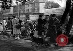 Image of Women pick up abandoned flowers London England United Kingdom, 1938, second 16 stock footage video 65675053799