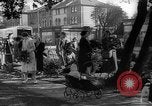 Image of Women pick up abandoned flowers London England United Kingdom, 1938, second 18 stock footage video 65675053799