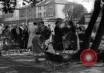 Image of Women pick up abandoned flowers London England United Kingdom, 1938, second 22 stock footage video 65675053799