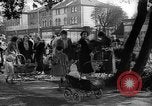 Image of Women pick up abandoned flowers London England United Kingdom, 1938, second 23 stock footage video 65675053799