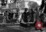 Image of Women pick up abandoned flowers London England United Kingdom, 1938, second 25 stock footage video 65675053799