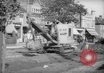 Image of steam shovel and heavy timbers at construction site London England United Kingdom, 1938, second 13 stock footage video 65675053800