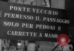 Image of Italian people crossing the war damaged Ponte Vecchio Bridge in Floren Florence Italy, 1945, second 8 stock footage video 65675053879