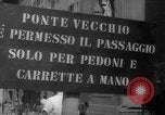 Image of Italian people crossing the war damaged Ponte Vecchio Bridge in Floren Florence Italy, 1945, second 11 stock footage video 65675053879