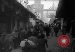 Image of Italian people crossing the war damaged Ponte Vecchio Bridge in Floren Florence Italy, 1945, second 17 stock footage video 65675053879