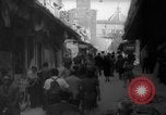 Image of Italian people crossing the war damaged Ponte Vecchio Bridge in Floren Florence Italy, 1945, second 19 stock footage video 65675053879