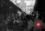 Image of Italian people crossing the war damaged Ponte Vecchio Bridge in Floren Florence Italy, 1945, second 20 stock footage video 65675053879