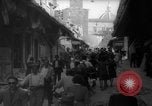 Image of Italian people crossing the war damaged Ponte Vecchio Bridge in Floren Florence Italy, 1945, second 26 stock footage video 65675053879