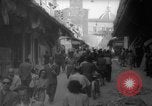 Image of Italian people crossing the war damaged Ponte Vecchio Bridge in Floren Florence Italy, 1945, second 39 stock footage video 65675053879