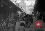 Image of Italian people crossing the war damaged Ponte Vecchio Bridge in Floren Florence Italy, 1945, second 40 stock footage video 65675053879