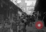 Image of Italian people crossing the war damaged Ponte Vecchio Bridge in Floren Florence Italy, 1945, second 43 stock footage video 65675053879