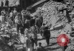 Image of Italian people crossing the war damaged Ponte Vecchio Bridge in Floren Florence Italy, 1945, second 52 stock footage video 65675053879