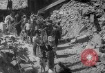 Image of Italian people crossing the war damaged Ponte Vecchio Bridge in Floren Florence Italy, 1945, second 58 stock footage video 65675053879