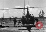 Image of U.S. Marine Corps UH-1E Huey gunship and  A-4 jet attack target Da Nang Vietnam, 1967, second 4 stock footage video 65675054269
