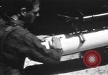 Image of U.S. Marine Corps UH-1E Huey gunship and  A-4 jet attack target Da Nang Vietnam, 1967, second 21 stock footage video 65675054269