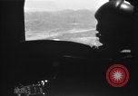 Image of U.S. Marine Corps UH-1E Huey gunship and  A-4 jet attack target Da Nang Vietnam, 1967, second 29 stock footage video 65675054269