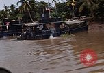 Immagine di Mobile forza fluviali barche in Vietnam Delta del Mekong Vietnam, 1968, secondo 47 filmato di repertorio 65675054294