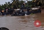Immagine di Mobile forza fluviali barche in Vietnam Delta del Mekong Vietnam, 1968, secondo 48 filmato di repertorio 65675054294