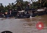 Immagine di Mobile forza fluviali barche in Vietnam Delta del Mekong Vietnam, 1968, secondo 49 filmato di repertorio 65675054294