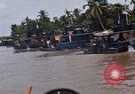 Immagine di Mobile forza fluviali barche in Vietnam Delta del Mekong Vietnam, 1968, secondo 54 filmato di repertorio 65675054294