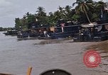 Immagine di Mobile forza fluviali barche in Vietnam Delta del Mekong Vietnam, 1968, secondo 56 filmato di repertorio 65675054294