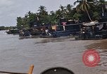 Immagine di Mobile forza fluviali barche in Vietnam Delta del Mekong Vietnam, 1968, secondo 57 filmato di repertorio 65675054294