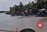 Immagine di Mobile forza fluviali barche in Vietnam Delta del Mekong Vietnam, 1968, secondo 59 filmato di repertorio 65675054294