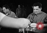 Image of Italian prisoners of war in mess line on USS Wasp (CV-18) Atlantic Ocean, 1945, second 13 stock footage video 65675054311