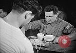 Image of Italian prisoners of war in mess line on USS Wasp (CV-18) Atlantic Ocean, 1945, second 15 stock footage video 65675054311