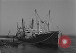 Image of Coast Guard cutter refueling Cherbourg Normandy France, 1944, second 13 stock footage video 65675054756